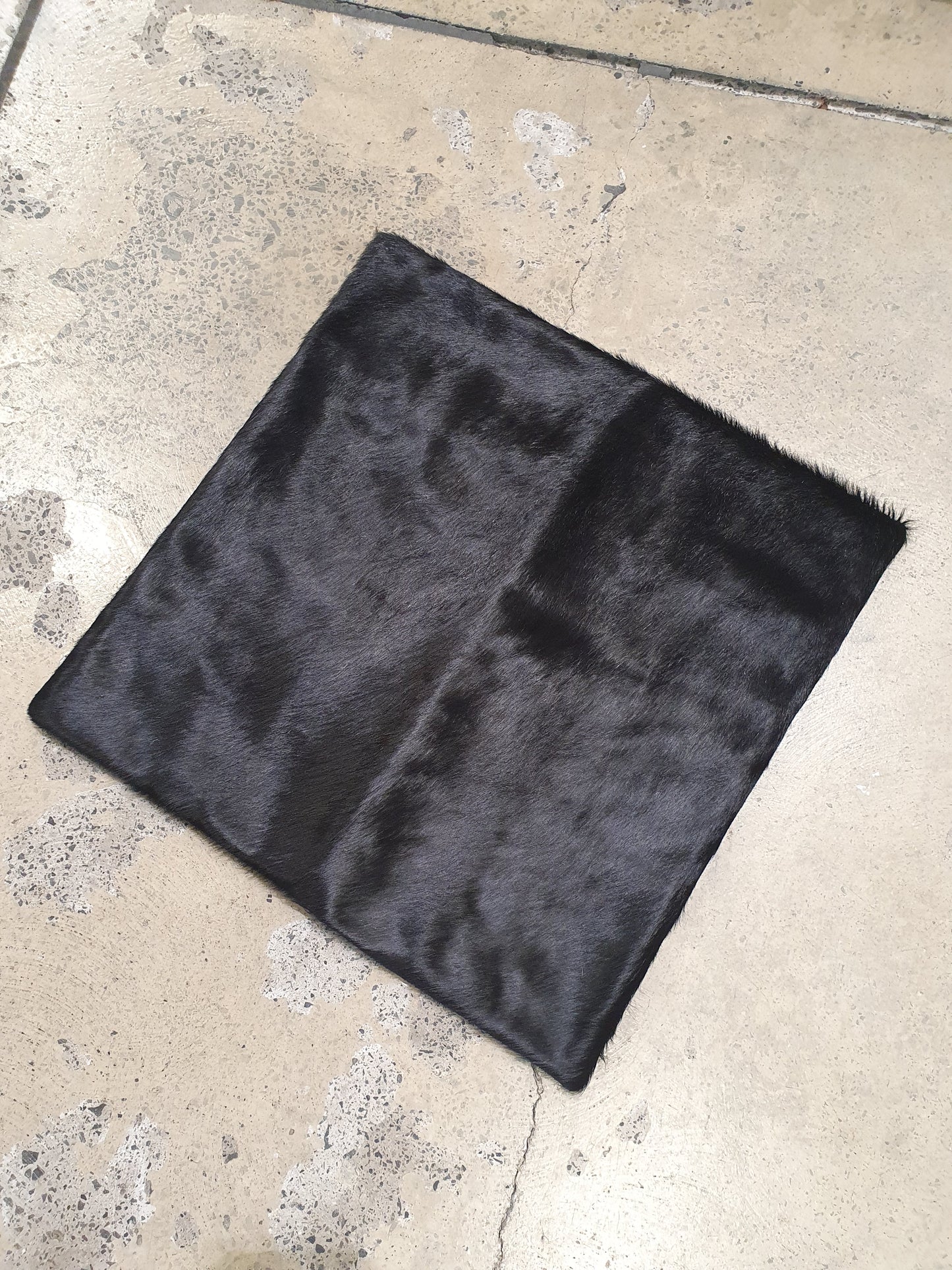 The Design Edge single panel cowhide pillow cover