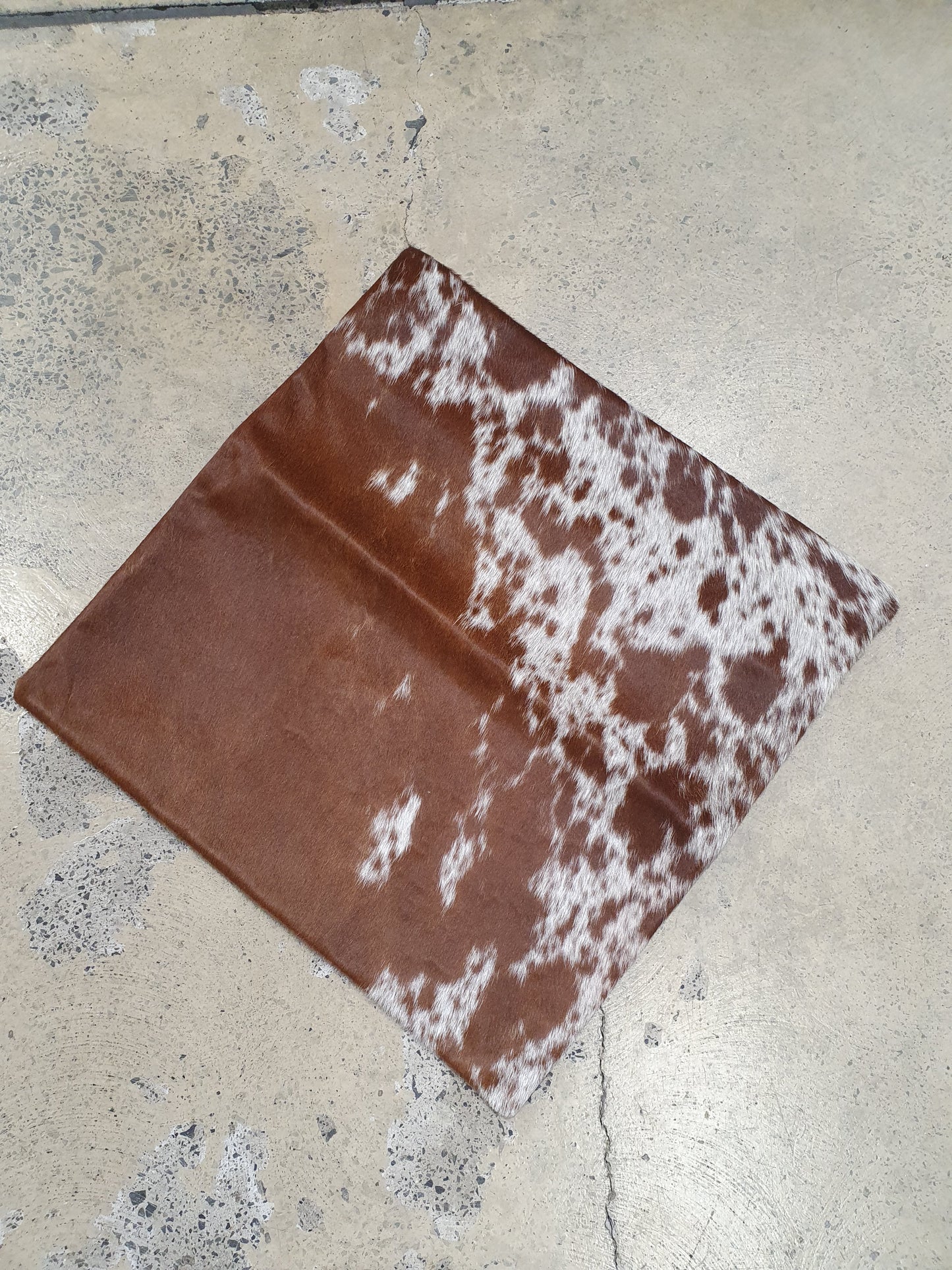 The Design Edge single panel cowhide pillow cover